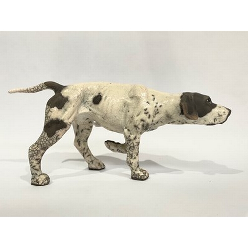 517 - Kenza Rudge (British, b.1966), Studio Pottery: a Raku-fired pointer gun dog, front left leg raised, ... 