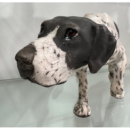 517 - Kenza Rudge (British, b.1966), Studio Pottery: a Raku-fired pointer gun dog, front left leg raised, ... 