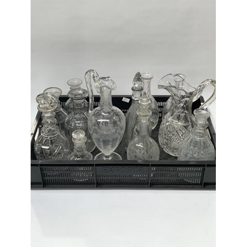 52 - A collection of George III and 19th century cut glass decanters and claret jugs, including Prussian ... 