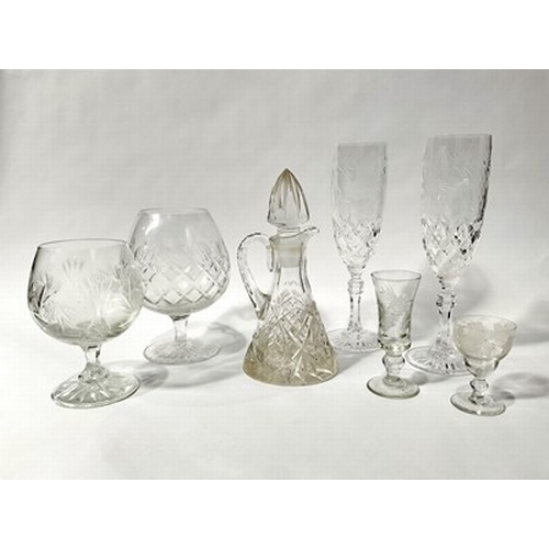 55 - An assortment of cut and moulded glasses to include Waterford and Tudor (2 trays)