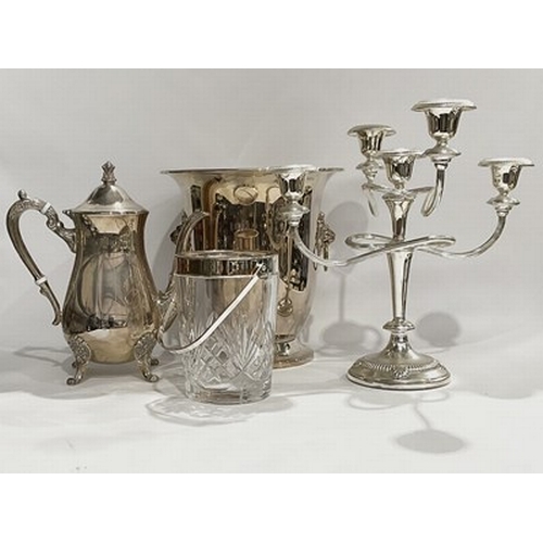 61 - An assortment of silver plated dinnerware, including two tea kettles, a large drinks tray with decor... 