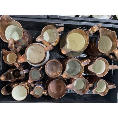 62 - A large collection of 19th century English Staffordshire copper lustreware: teapots, jugs, goblets, ... 