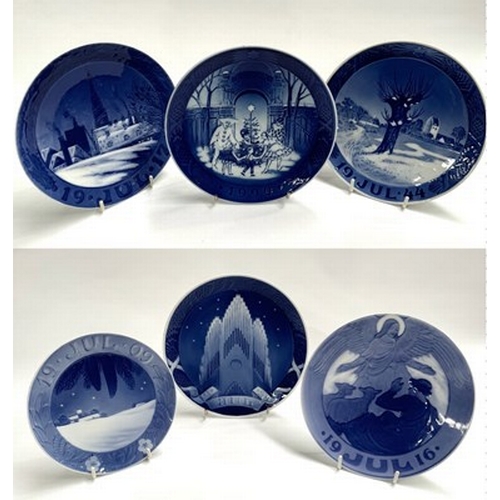 71 - A collection of Royal Copenhagen annual Christmas plates dating from 1909 onwards, including plates ... 