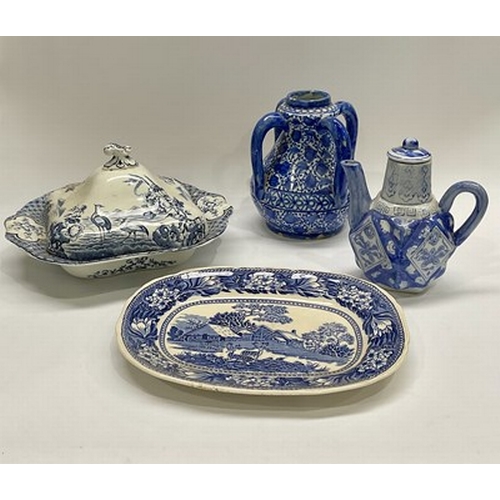 77 - A collection of 19th-century and later blue and white ceramics including plates, large chargers, tur... 