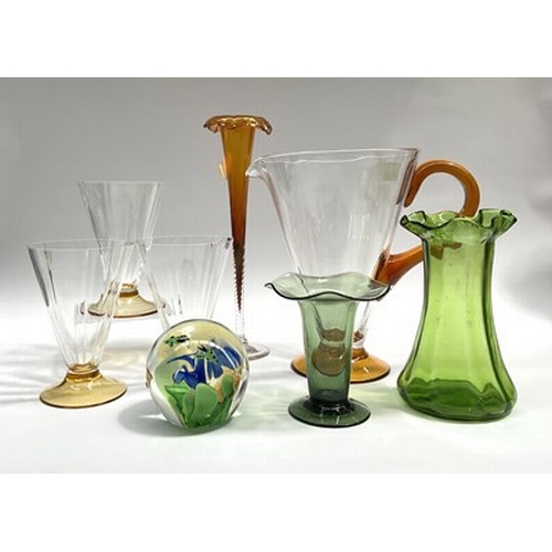 84 - A collection of glass wares featuring a Jackfield-type sparrow beak jug on three feet, Czech glass a... 