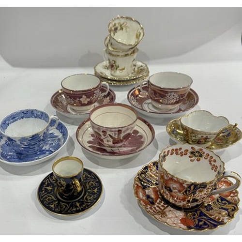 97 - A collection of 19th and 20th century tea cups and saucers, many hand-painted and gilded, to include... 