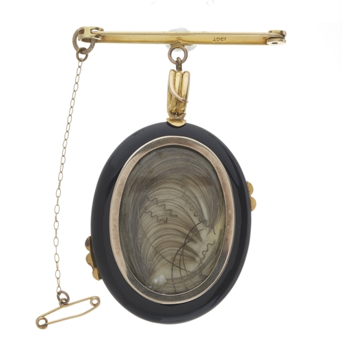 11 - A 19th century 15ct gold onyx locket pendant, with coiled snake overlay and surmount, suspended from... 