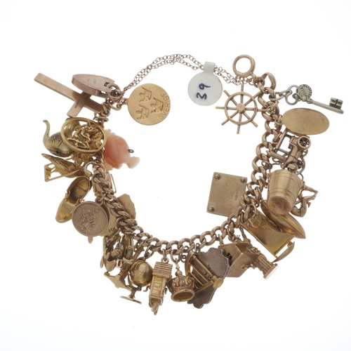 120 - A mid 20th century gold charm bracelet, suspending 32 charms, with bolt ring clasp, most with hallma... 