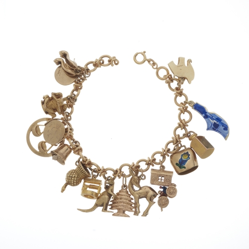 121 - A mid 20th century 18ct gold charm bracelet, suspending sixteen charms, ten with hallmarks for 9ct g... 