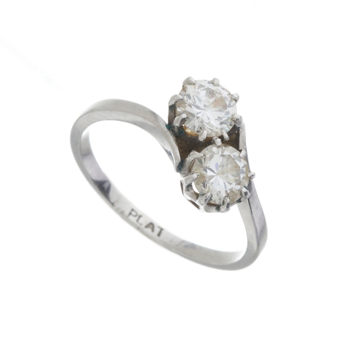 127 - A mid 20th century platinum circular-cut diamond two-stone crossover ring, estimated total diamond w... 