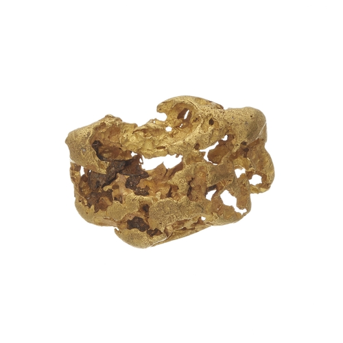 136 - A gold nugget, measuring approximately 8.8mm by 3.2mm, 5.7g