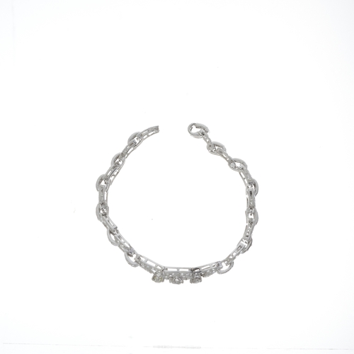 140 - An Art Deco platinum old-cut diamond openwork panel bracelet, estimated total diamond weight 5.50ct,... 