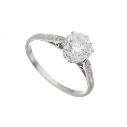 141 - An Art Deco platinum transitional-cut diamond single-stone ring, with diamond shoulders, principal d... 