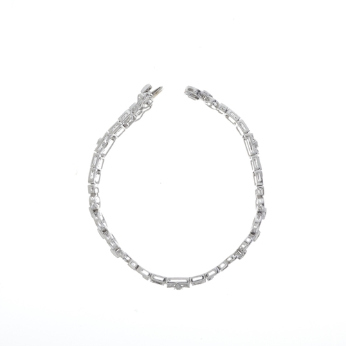 145 - An 18ct gold diamond openwork bracelet, total diamond weight 2.50ct, stamped to mount, estimated H-I... 