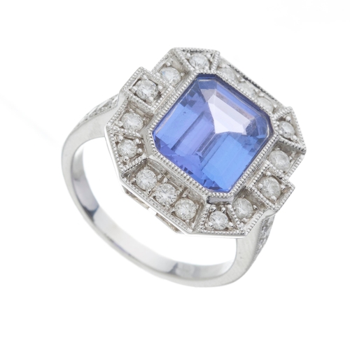 149 - An 18ct gold tanzanite and diamond cluster dress ring, tanzanite estimated weight 3.25ct, estimated ... 