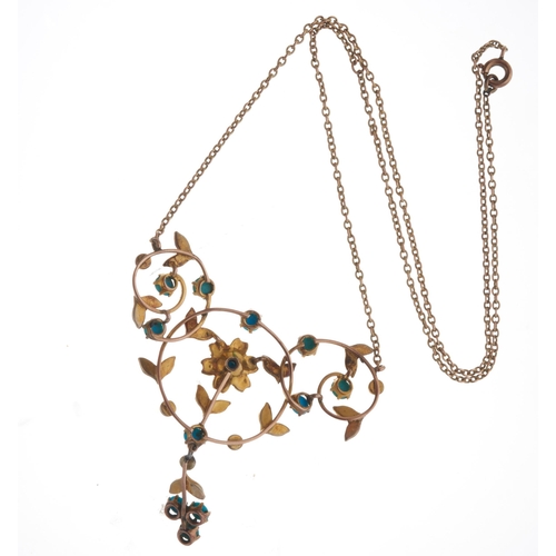 15 - An Edwardian gold turquoise cabochon and split pearl floral openwork necklace, with integral trace-l... 