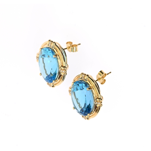 159 - A pair of 18ct gold oval-shape blue topaz stud earrings, with brilliant-cut diamond accent surround,... 