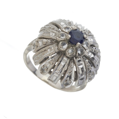 166 - A mid 20th century 18ct gold sapphire and white gem bombe ring, band stamped 750, ring size K1/2, 9.... 