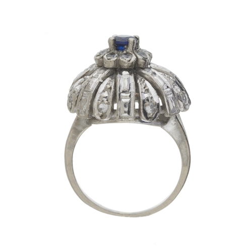 166 - A mid 20th century 18ct gold sapphire and white gem bombe ring, band stamped 750, ring size K1/2, 9.... 