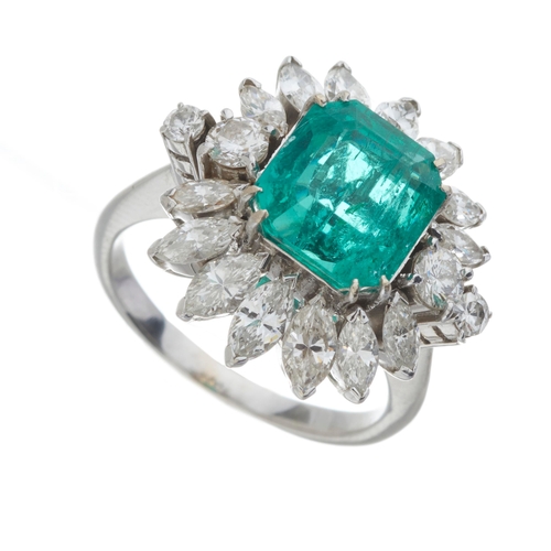 183 - An impressive 18ct gold Colombian emerald and marquise-shape diamond cocktail ring, with brilliant-c... 