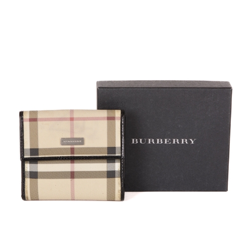 228 - Burberry, a House Check wallet, featuring the maker's classic house check coated canvas exterior wit... 