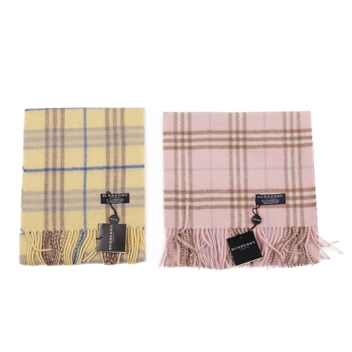 233 - Burberry, two Nova Check lambswool scarves, to include a baby pink scarf and a pale yellow scarf, bo... 