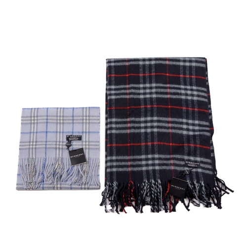 236 - Burberry, a Nova Check lambswool shawl and scarf, to include a navy blue shawl and a pale blue scarf... 