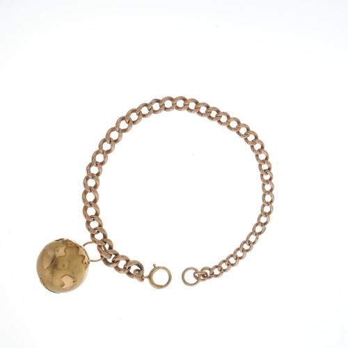 24 - A late Victorian gold curb-link bracelet, with globe charm of similar age, charm stamped 750, bracel... 