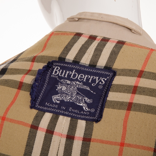 240 - Burberry, a men's classic trench coat, designed with a notched lapel collar, buttoned epaulettes, de... 