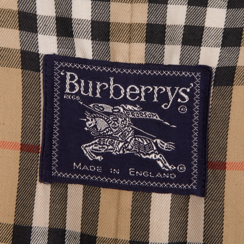 241 - Burberry, a ladies classic trench coat, designed with a notched lapel collar, buttoned epaulettes, d... 