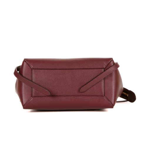 249 - Celine, a Micro Belt handbag, crafted from burgundy grained calfskin leather with gold-tone hardware... 