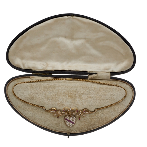 25 - An Edwardian 15ct gold ruby and split pearl heart-shape locket pendant, with similarly-set surmount ... 