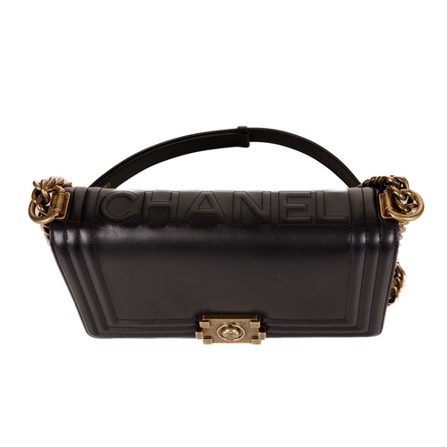 251 - Chanel, a black Medium Boy handbag, designed with a smooth calf leather exterior and ribbed border, ... 