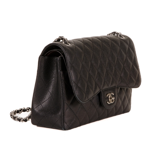 252 - Chanel, a Jumbo Classic Double Flap handbag, featuring a black caviar quilted leather exterior, with... 