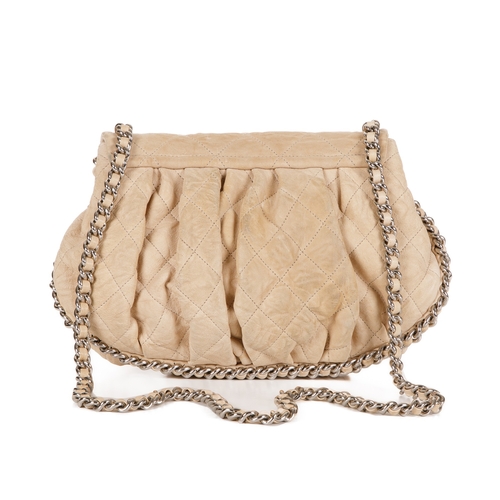 255 - Chanel, a Chain Around Timeless Flap handbag, crafted from cream quilted leather, featuring soft ple... 