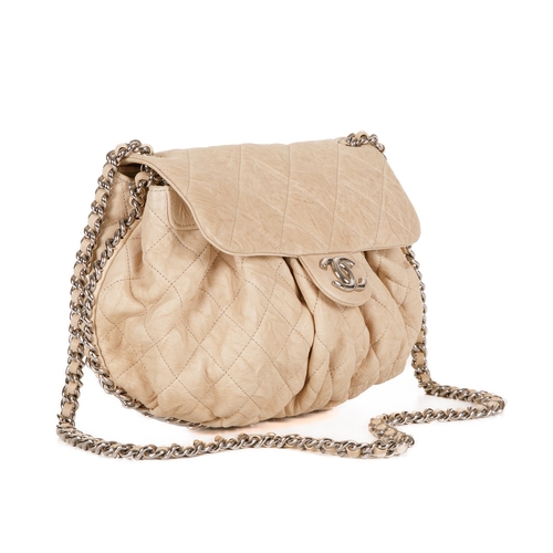 255 - Chanel, a Chain Around Timeless Flap handbag, crafted from cream quilted leather, featuring soft ple... 