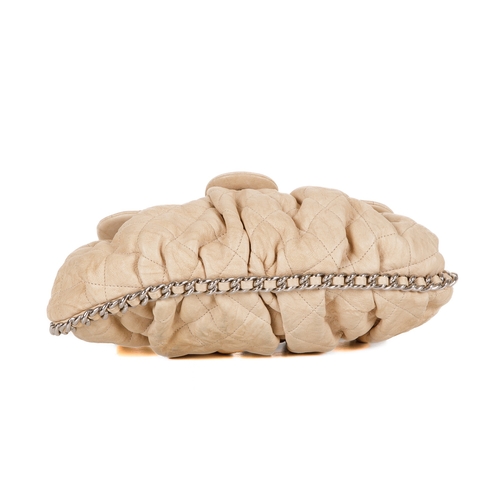 255 - Chanel, a Chain Around Timeless Flap handbag, crafted from cream quilted leather, featuring soft ple... 