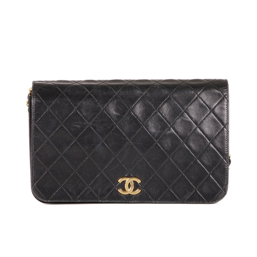 257 - Chanel, a vintage CC Push Lock Full Flap handbag, designed with a diamond quilted black leather exte... 