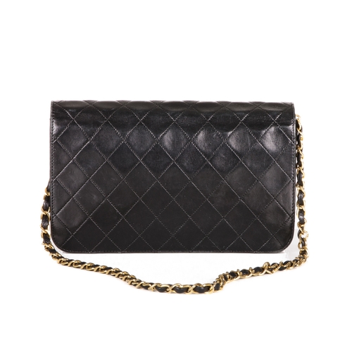 257 - Chanel, a vintage CC Push Lock Full Flap handbag, designed with a diamond quilted black leather exte... 