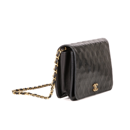 257 - Chanel, a vintage CC Push Lock Full Flap handbag, designed with a diamond quilted black leather exte... 