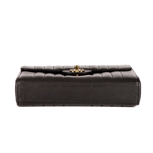 259 - Chanel, a vintage vertical Classic Flap handbag, crafted from black lambskin leather, with vertical ... 