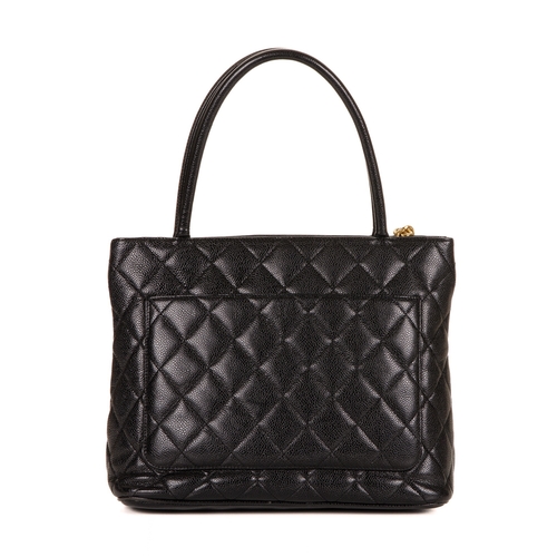 260 - Chanel, a Timeless Medallion tote, crafted from black caviar leather with the maker's classic diamon... 