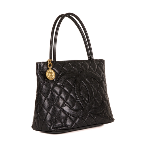 260 - Chanel, a Timeless Medallion tote, crafted from black caviar leather with the maker's classic diamon... 