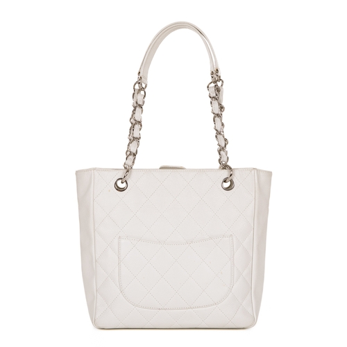 261 - Chanel, a Petite Shopping Tote, crafted from grained white caviar leather with maker's classic diamo... 