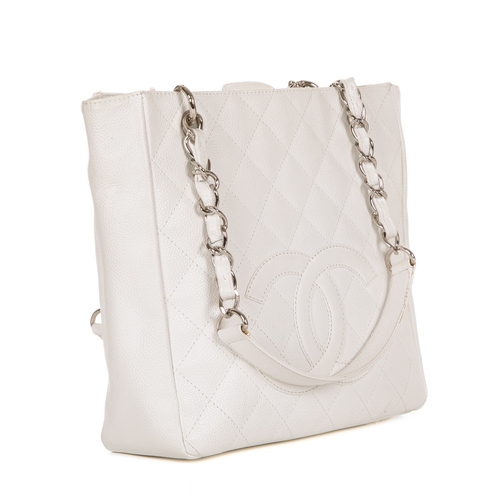 261 - Chanel, a Petite Shopping Tote, crafted from grained white caviar leather with maker's classic diamo... 