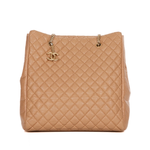 262 - Chanel, a large tan leather tote, crafted from diamond quilted crinkled calfskin leather, with brush... 