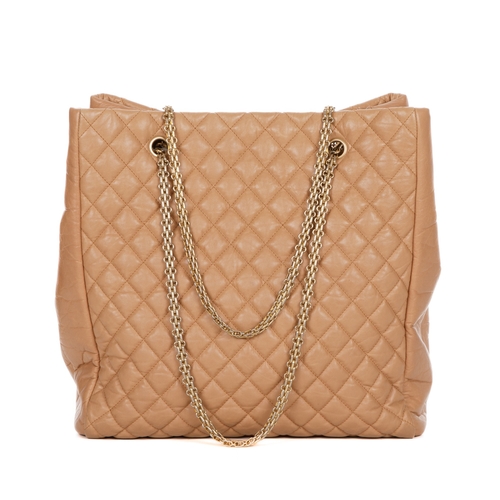 262 - Chanel, a large tan leather tote, crafted from diamond quilted crinkled calfskin leather, with brush... 