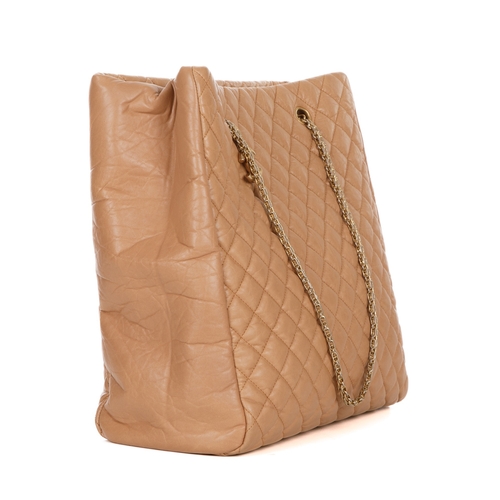 262 - Chanel, a large tan leather tote, crafted from diamond quilted crinkled calfskin leather, with brush... 