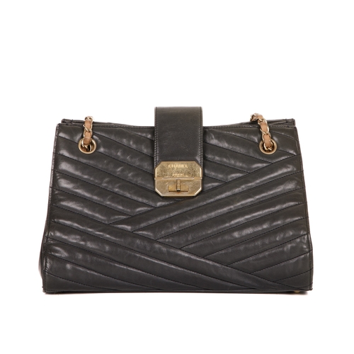 263 - Chanel, a Gabrielle Accordion tote, featuring a chevron-quilted leather exterior, with brushed gold-... 