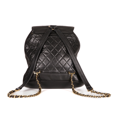 264 - Chanel, a vintage black quilted leather backpack w/pouch, featuring gold-tone hardware, a front patc... 